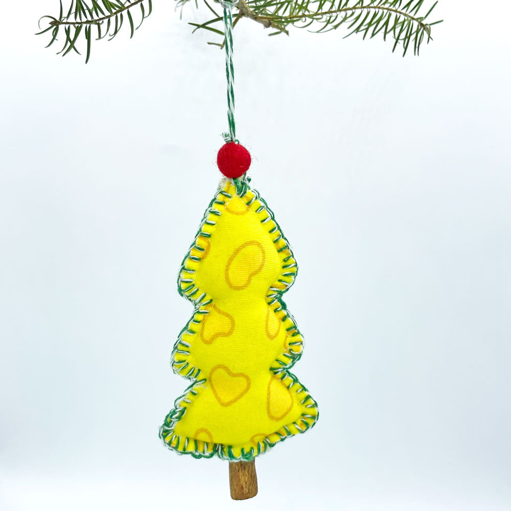 Yellow tree shaped christmas ornament handmade from yellow, organic cotton cheese fabric by Sunny Day Designs. Ornament is shown hanging from a Christmas tree branch against a white background. Made in the USA.