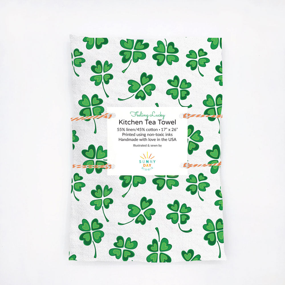 Green and white, Irish-themed, four-leaf clover patterned kitchen tea towel. Perfect for St. Patrick's Day! Designed and handmade in the USA from durable and soft  linen/cotton fabric.