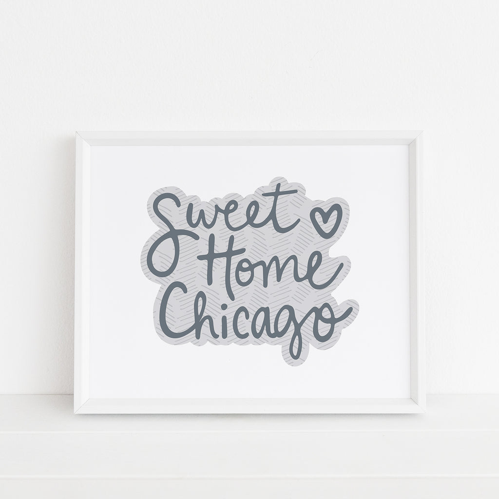 Framed 8x10 'Sweet Home Chicago' art print by Sunny Day Designs in charcoal gray, featuring handwritten text with a heart accent, displayed against a white background.