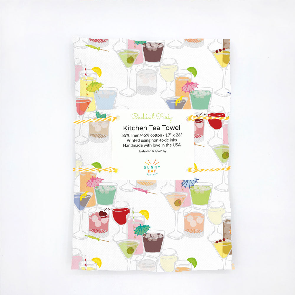 A handmade, packaged kitchen tea towel printed with an illustration of various colorful cocktail and mocktail drinks. This linen/cotton dish towel is designed and made in the USA by Sunny Day Designs.