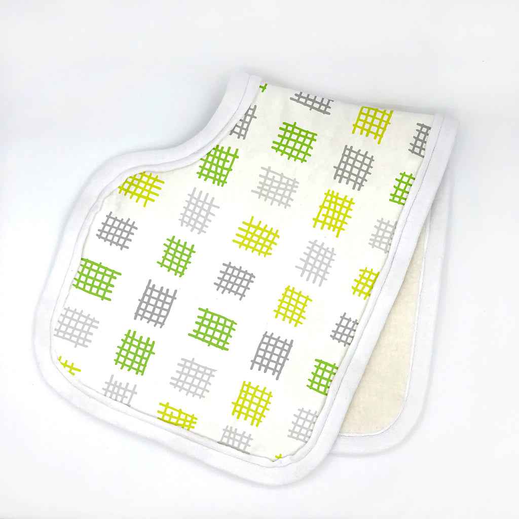 Contoured white baby burp cloth featuring an abstract repeating grid pattern in lime green, apple green, grey and white inspired by criss-cross sketches. Displayed folded in half with white edging on a white background, from the Criss-Cross Applesauce organic cotton baby collection by Sunny Day Designs.