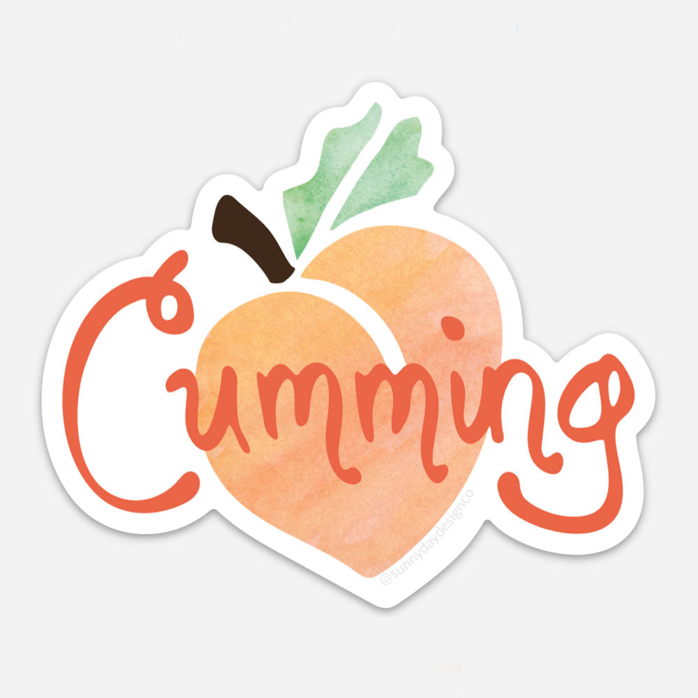 Cumming, Georgia city themed vinyl magnet featuring a watercolor peach design and hand lettered "Cumming" text in orange. Designed by Sunny Day Designs and made in the USA.