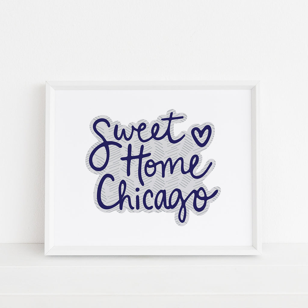 Framed 8x10 'Sweet Home Chicago' art print by Sunny Day Designs in navy blue, featuring handwritten text with a heart accent, displayed against a white background.