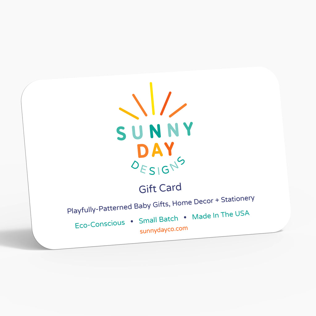 an image of an e-Gift Card to Sunny Day Designs (www.sunnydayco.com) is shown on a white background - which features the following text: Playfully-Patterned Baby Gifts, Home Decor + Stationery - Eco-Conscious, Small Batch & Made In The USA.