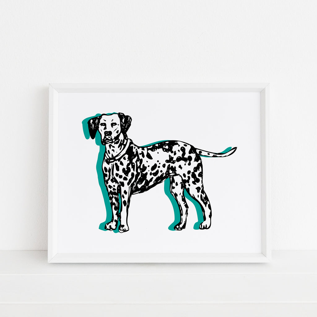 An adorable illustrated dog themed 8x10 art print featuring an adorable sketched dalmatian dog with turquoise accents is printed on white watercolor paper and shown framed inside a white picture frame.