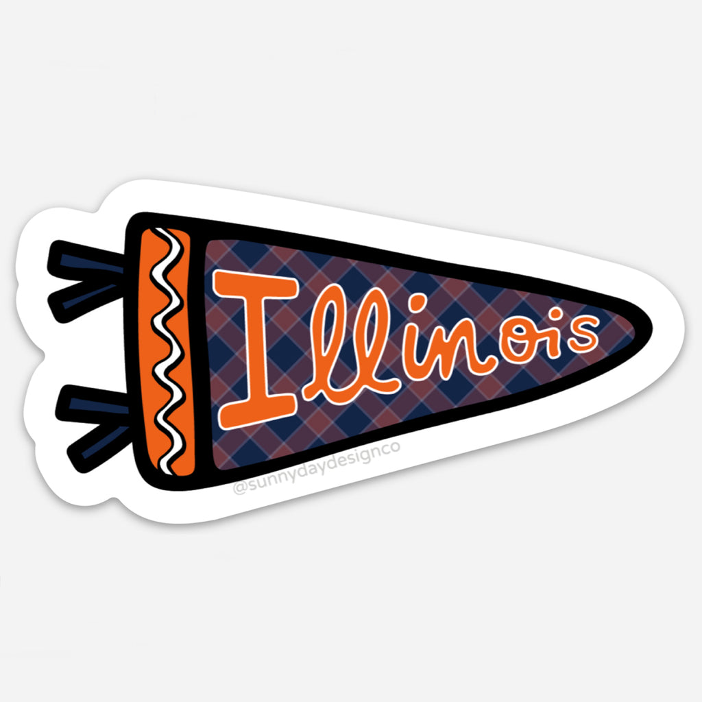 Vinyl magnet in the shape of a pennant flag with a navy blue and red plaid background and the word “Illinois” in orange hand-lettered script. Accented with orange and navy tassels and thick black trim, designed by Sunny Day Designs to represent University of Illinois pride.