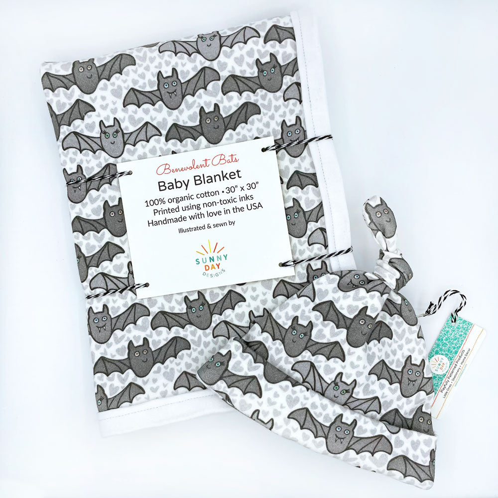 benevolent bats organic cotton baby gift set made in the USA by Sunny Day Designs with newborn hat and baby blanket in gray bat print design with gray hearts on white background