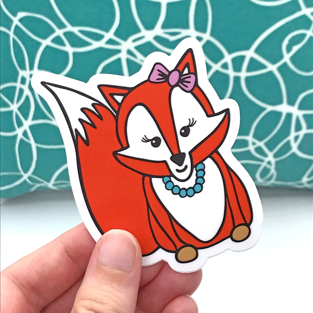 fun sticker of female fox with bow and necklace by sunny day designs