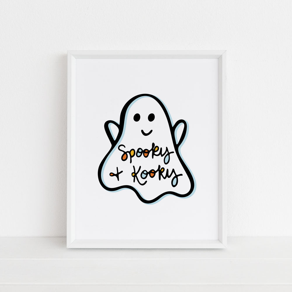 Spooky & Kooky illustrated ghost wall art by Sunny Day Designs. This smiling ghost illustration features hand lettered "Spooky & Kooky" text in orange, yellow, light blue, and black. This colorful art print makes cute Halloween decor! Designed by Sunny Day Designs and made in the usa.